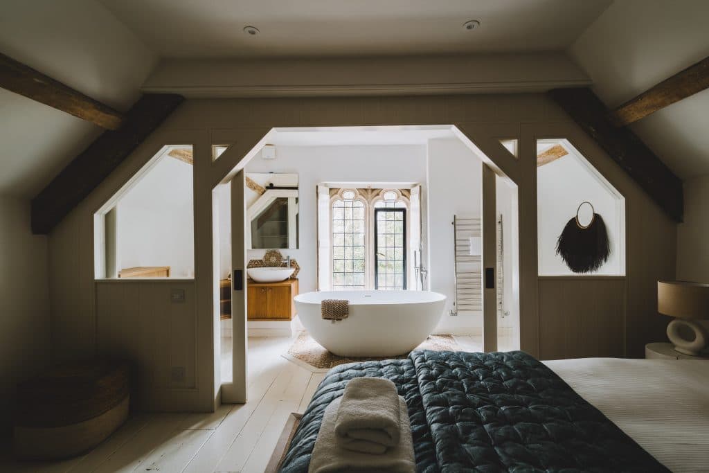 A bedroom with a freestanding bath at 42 Acres, Somerset